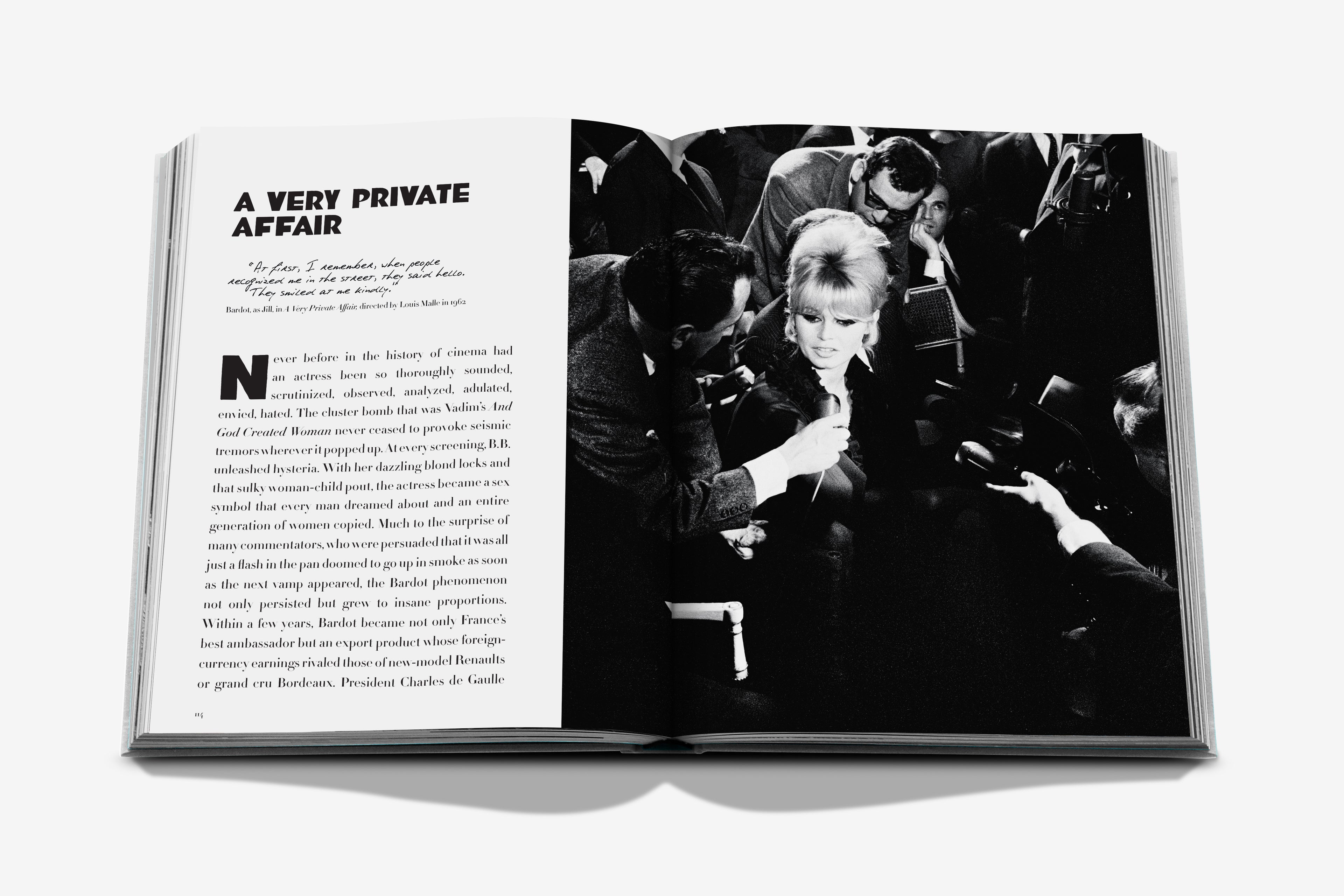 Open book showing a black and white photograph of a woman being filmed by a cameraman.