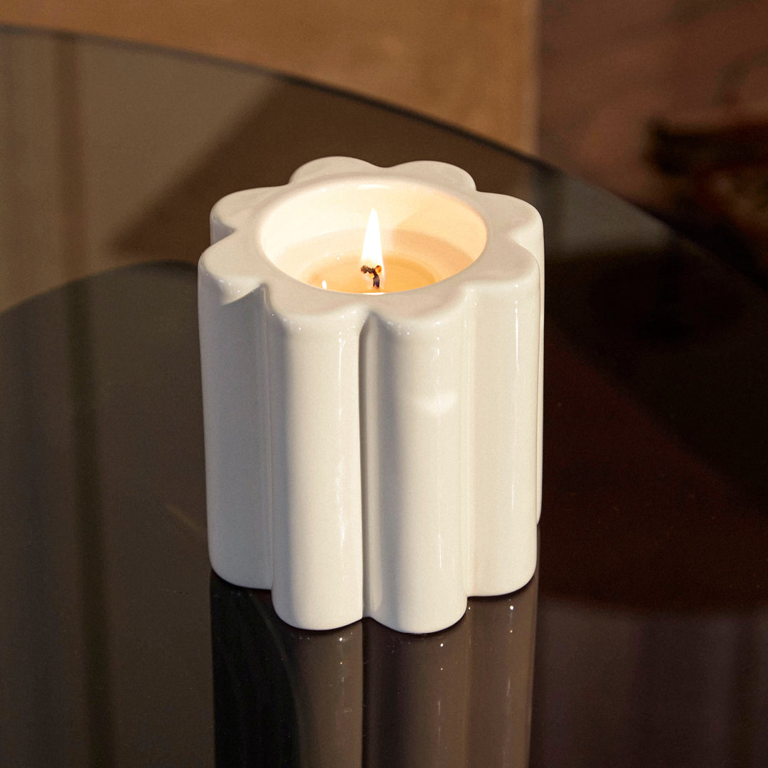 The Socialite Family Candela woodfire scented candle in a cream ceramic vessel, 240g, styled in a room setting 2