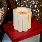 The Socialite Family Candela woodfire scented candle in a cream ceramic vessel, 240g, styled in a room setting 3