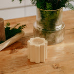 The Socialite Family Candela woodfire scented candle in a cream ceramic vessel, 240g, styled in a room setting