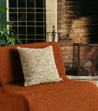 The Socialite Family Carino square cushion in brown and green tweed-effect fabric, 45x45cm, styled in a room setting