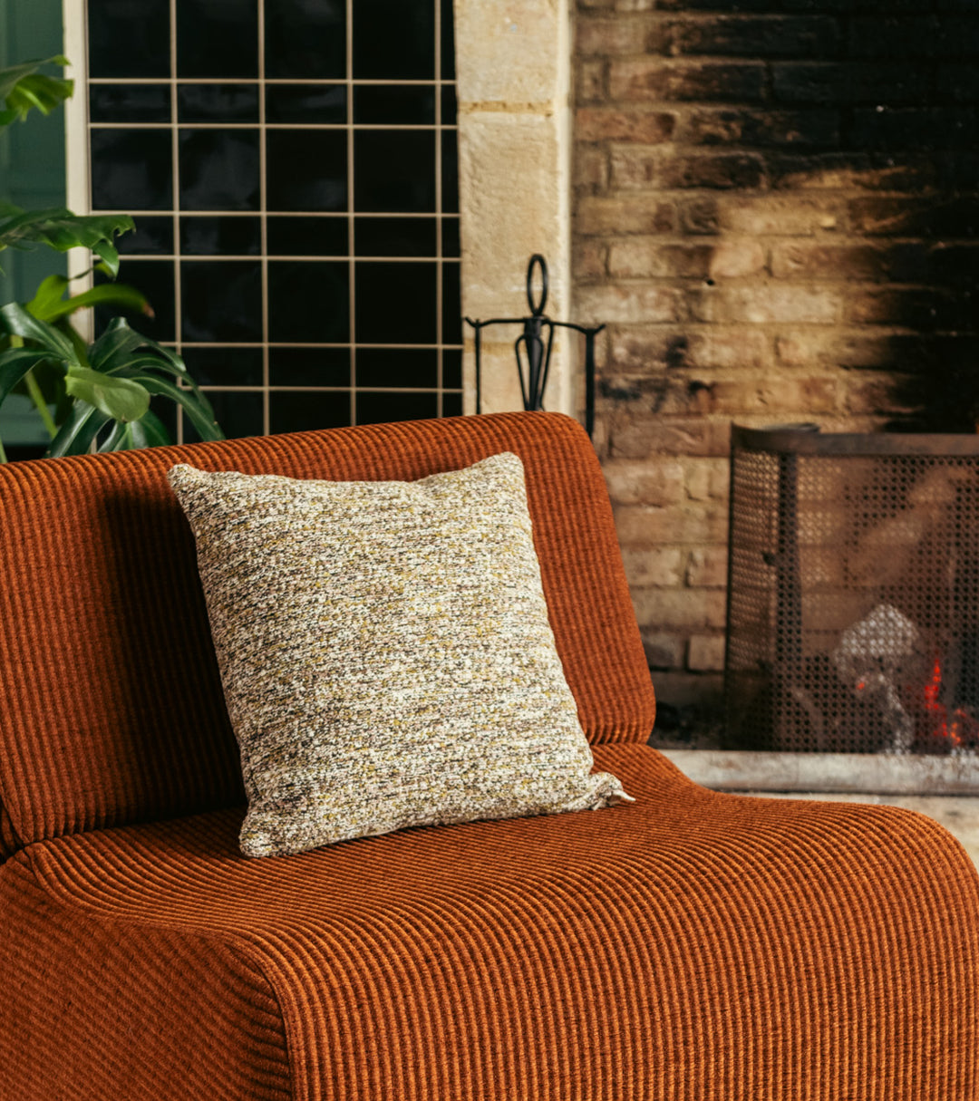 The Socialite Family Carino square cushion in brown and green tweed-effect fabric, 45x45cm, styled in a room setting