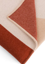 The Socialite Family Roma merino wool throw in beige and pink, 150x200cm, styled in a room setting 3